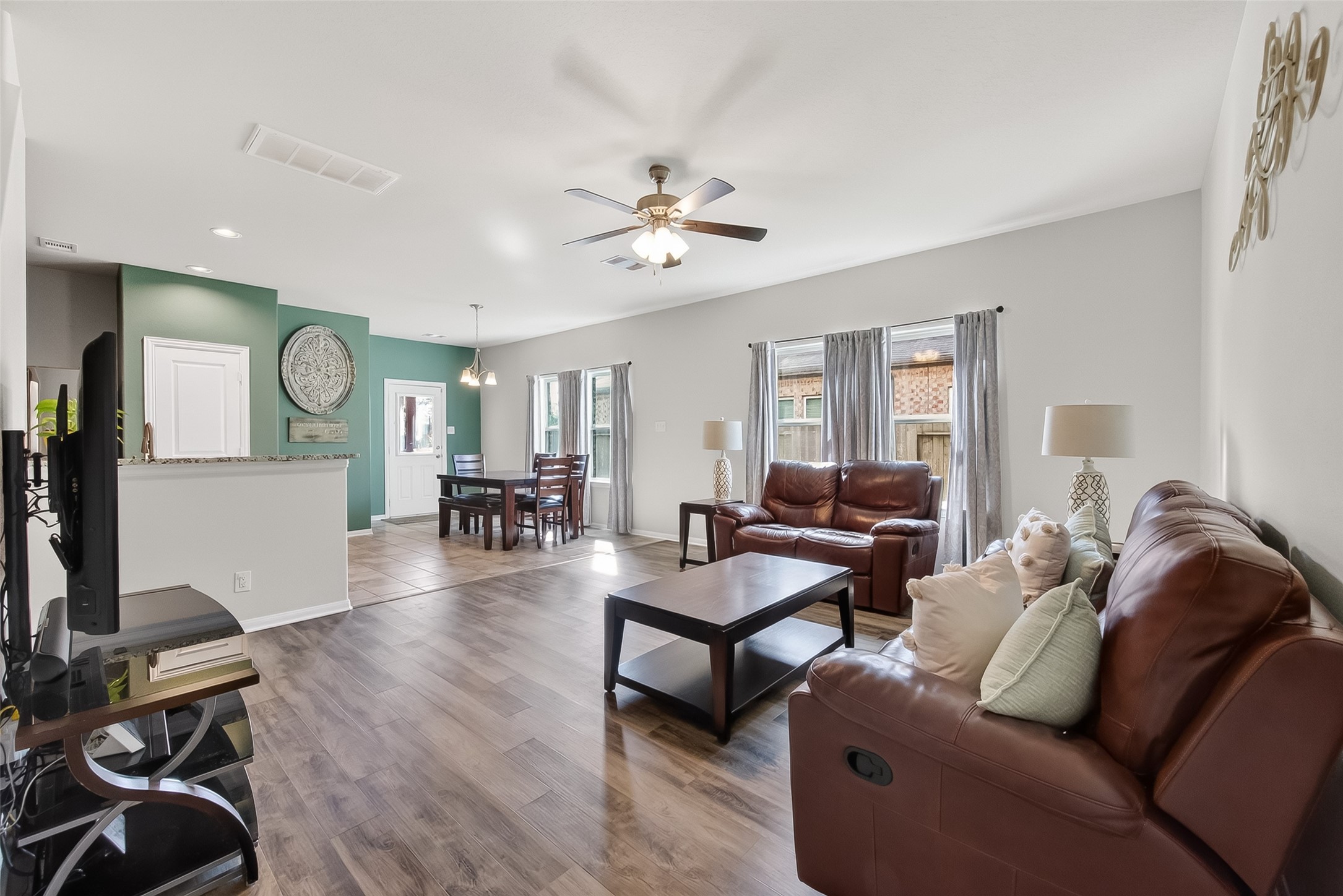 8630 Willet Street Baytown, TX 77521 - Photo 4 of 49 family room with wood-look floors