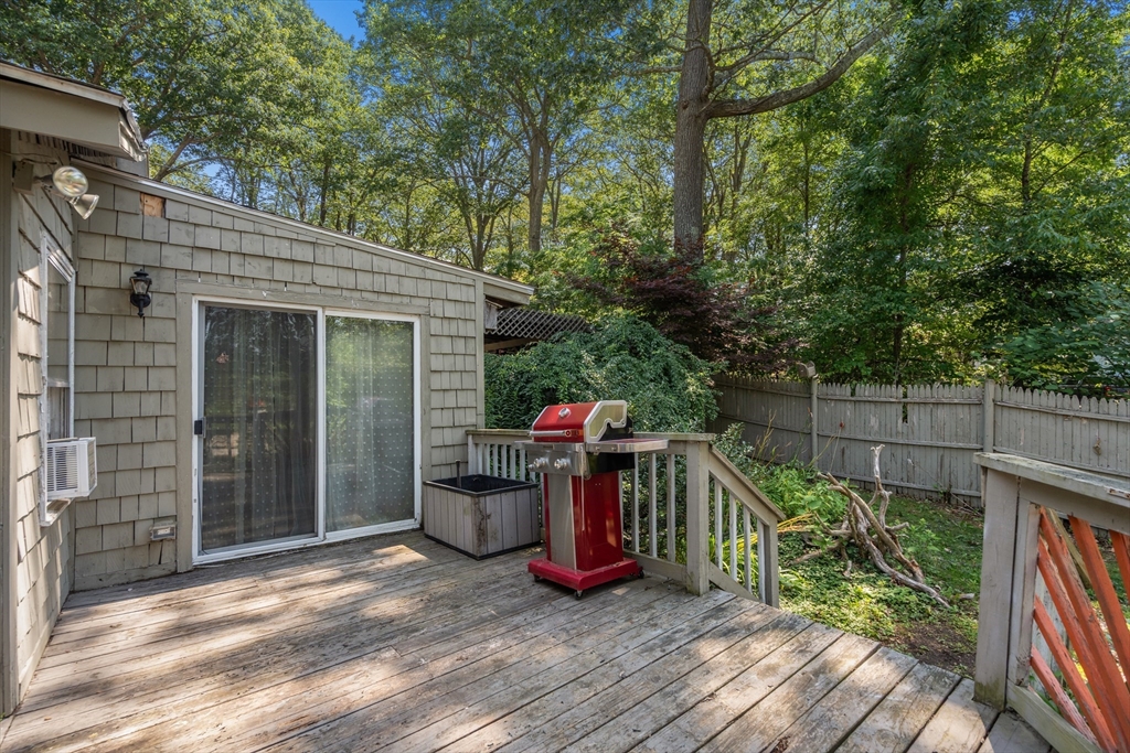 7 Victoria Avenue Rutland, MA 01543 - Photo 11 of 21 a view of a wooden house with a small yard and wooden fence