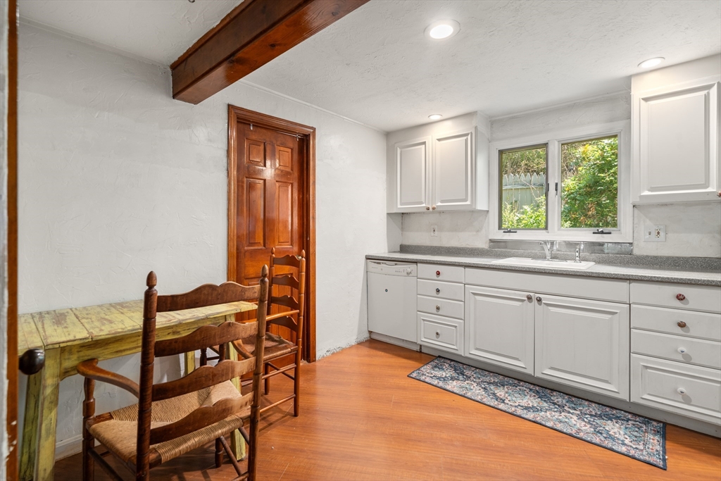 7 Victoria Avenue Rutland, MA 01543 - Photo 4 of 21 a kitchen with a sink window and cabinets