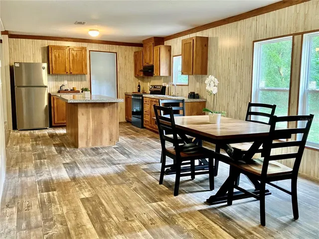 a view of a dining room with furniture
