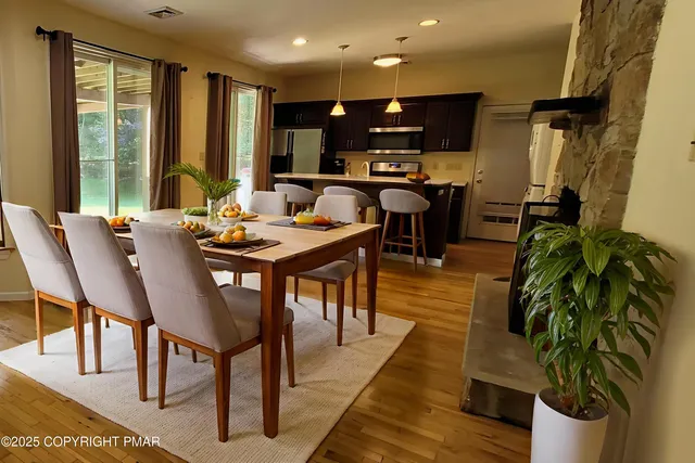 a view of a room with air conditioner and windows