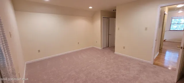 a bathroom with a shower and a sink