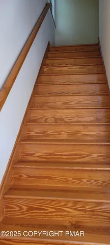 a view of house with a big yard