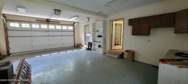 a view of a house with a yard and tree s