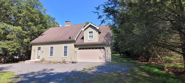 a view of a house with brick walls