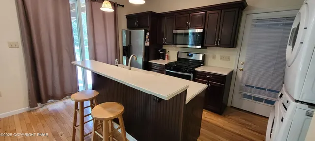a bathroom with a sink a mirror and a vanity