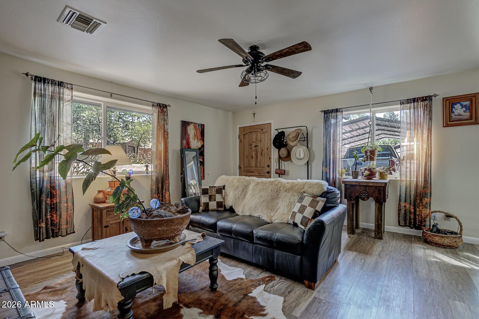 3762 Watertank Road Pine, AZ 85544 - Photo 3 of 38 a living room with furniture and wooden floor
