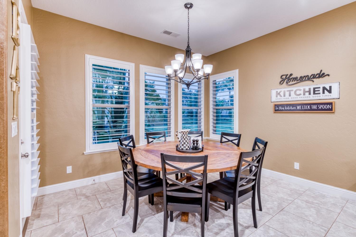 1967 Powers Avenue Clovis, CA 93619 - Photo 12 of 71 a view of a dining room with furniture window and outside view