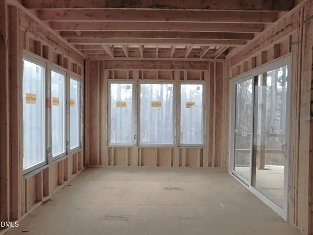 a view of an empty room with a sliding door
