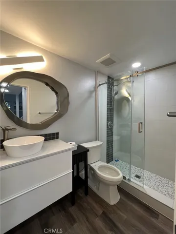 a living room with a couch and a mirror