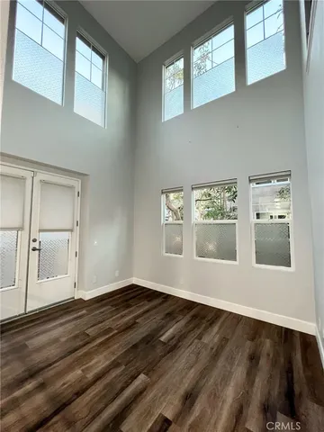 a bathroom with a granite countertop sink a toilet and shower