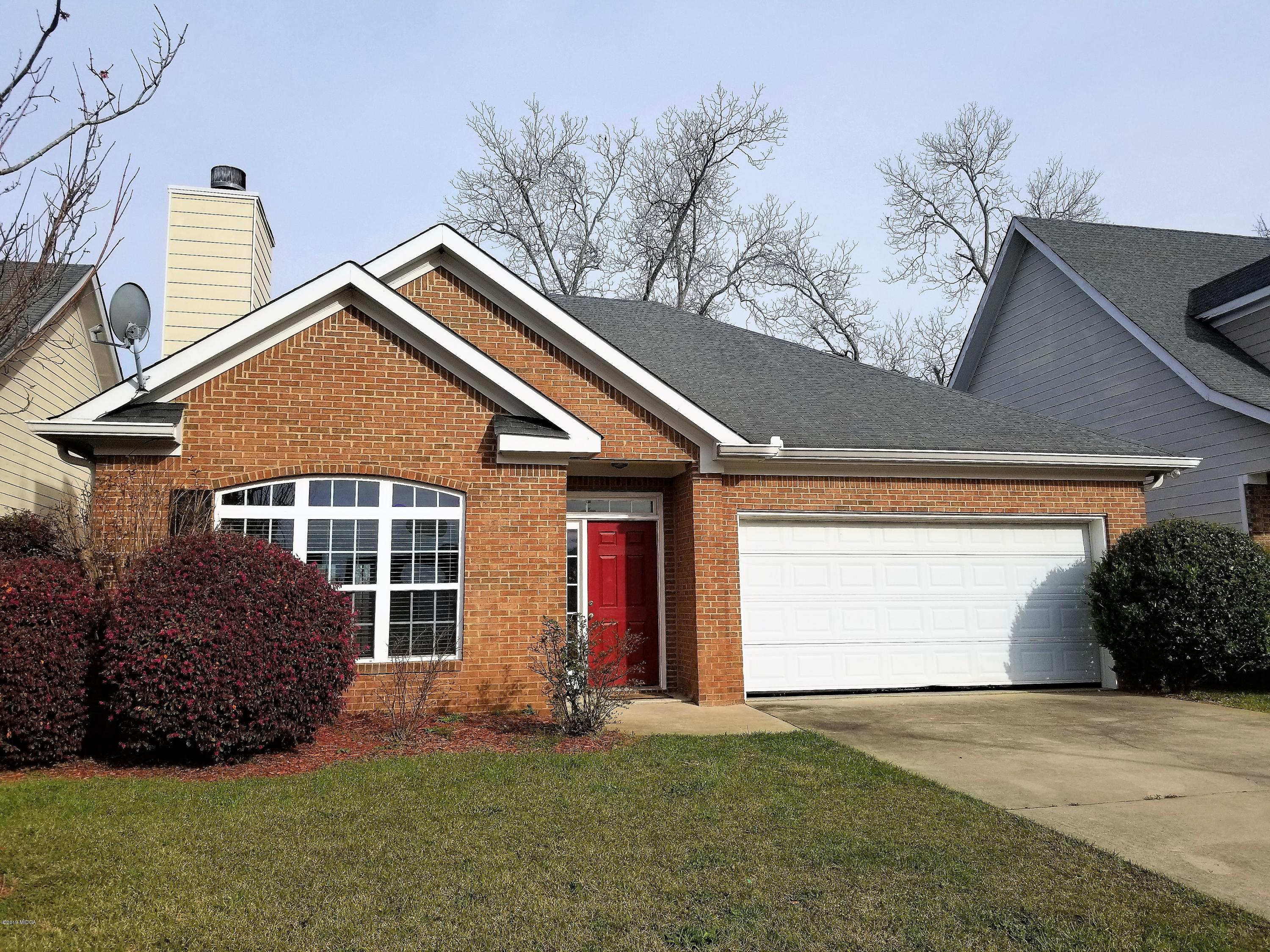 425 Bob White Road Macon, GA 31216 - Photo 1 of 20 a front view of a house with a yard and garage