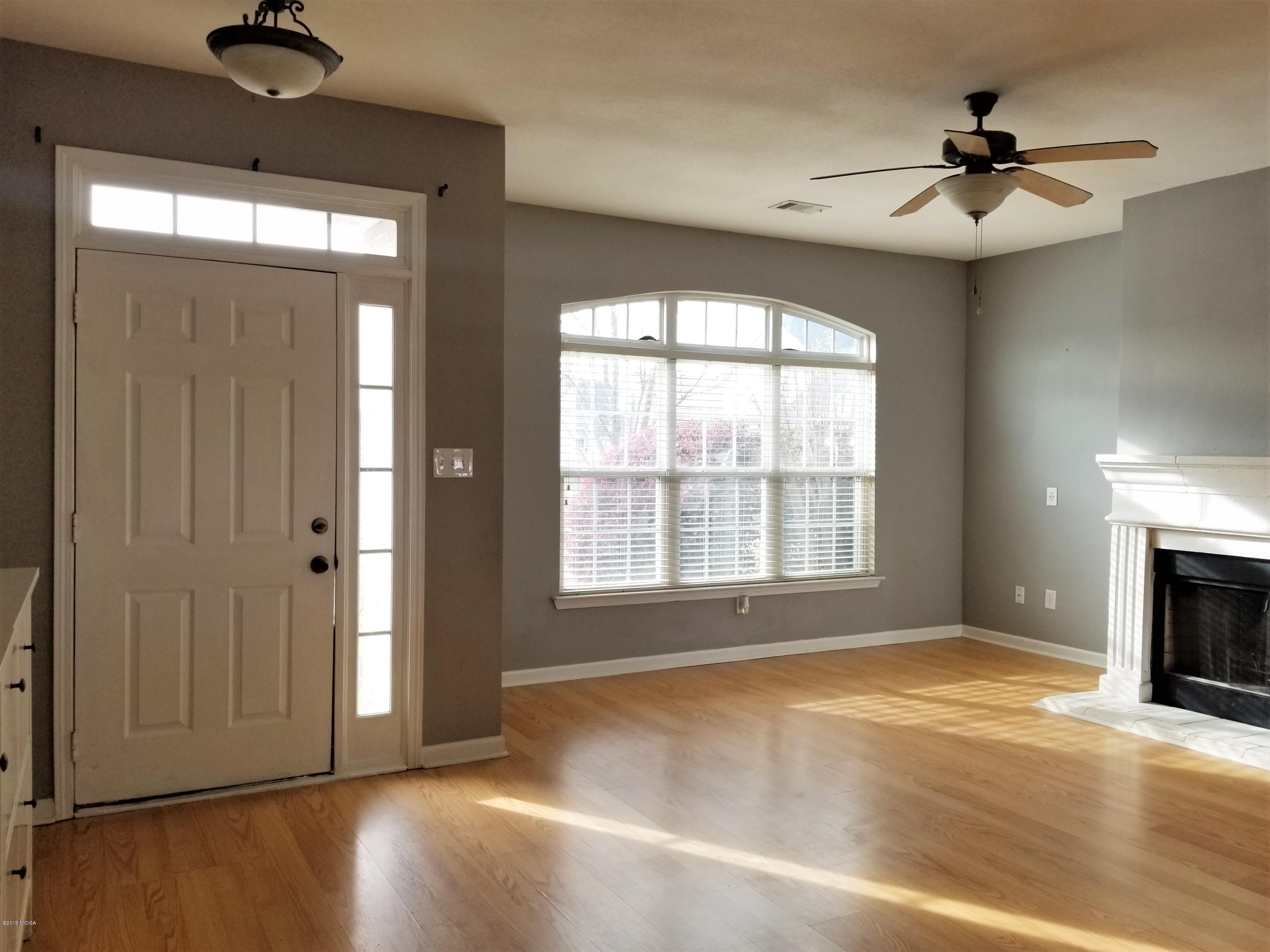 425 Bob White Road Macon, GA 31216 - Photo 2 of 20 a view of an empty room with a window and a ceiling fan