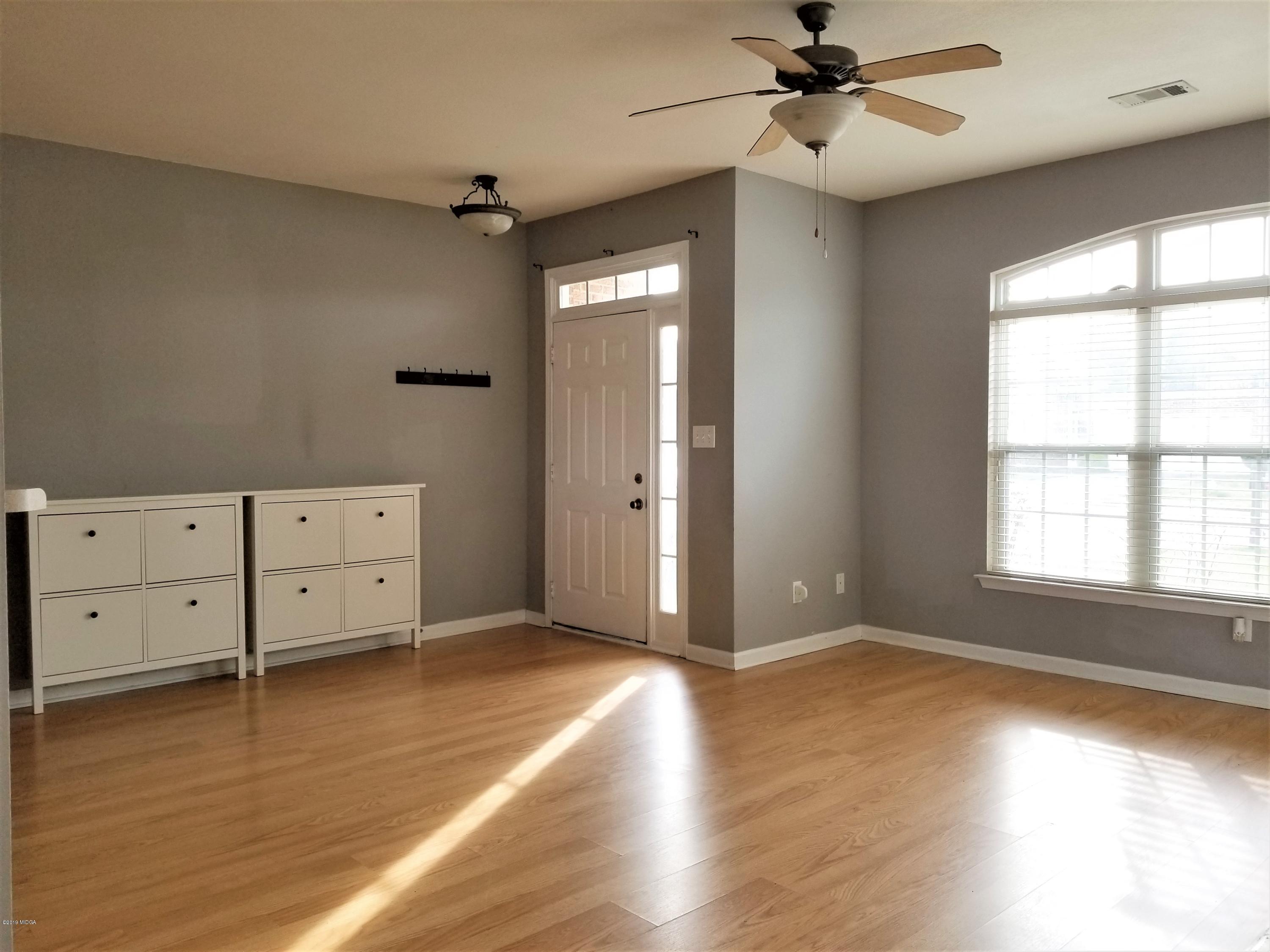 425 Bob White Road Macon, GA 31216 - Photo 11 of 20 wooden floor in an empty room with a window