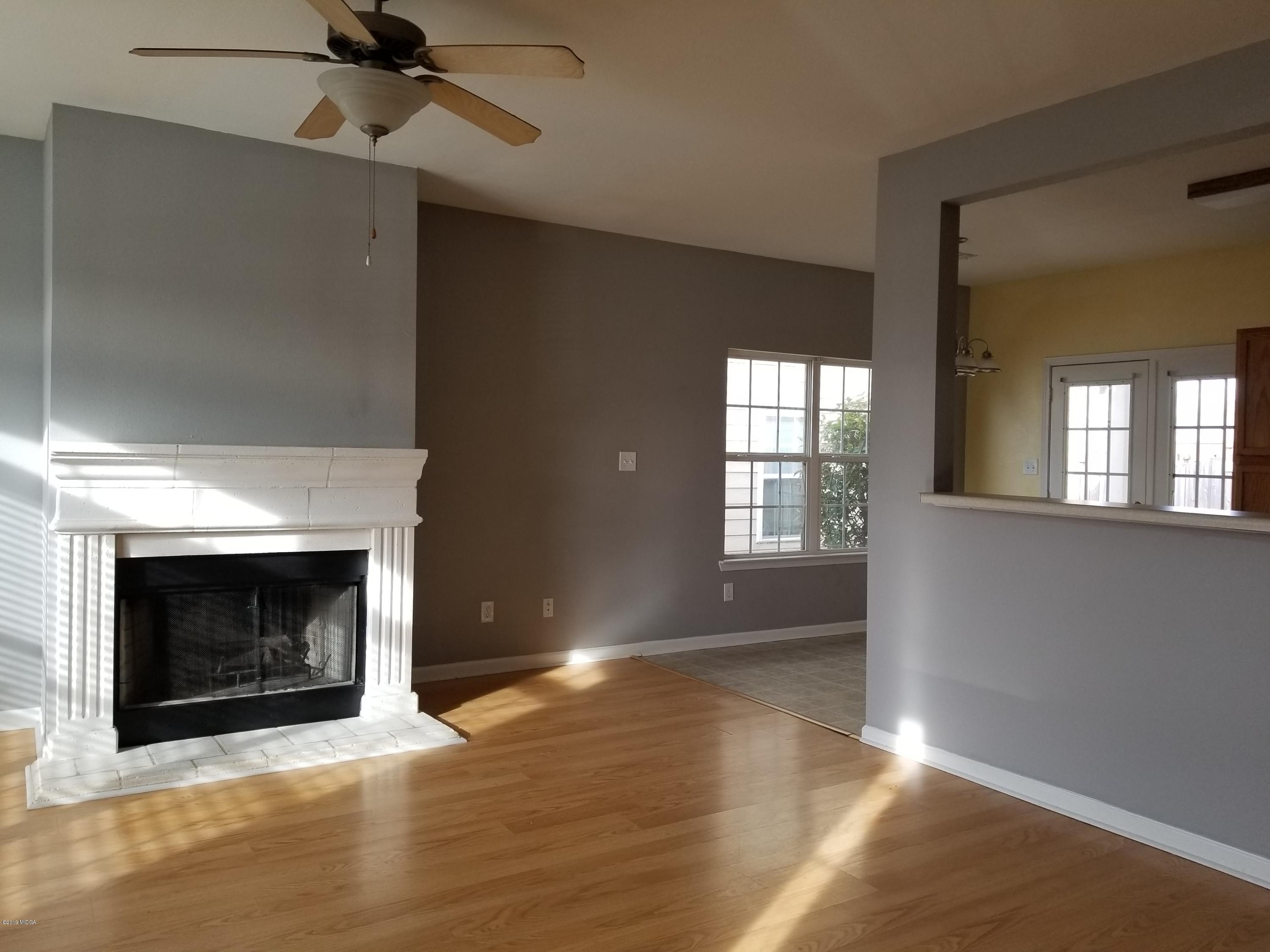 425 Bob White Road Macon, GA 31216 - Photo 4 of 20 a view of an empty room with window and fire place