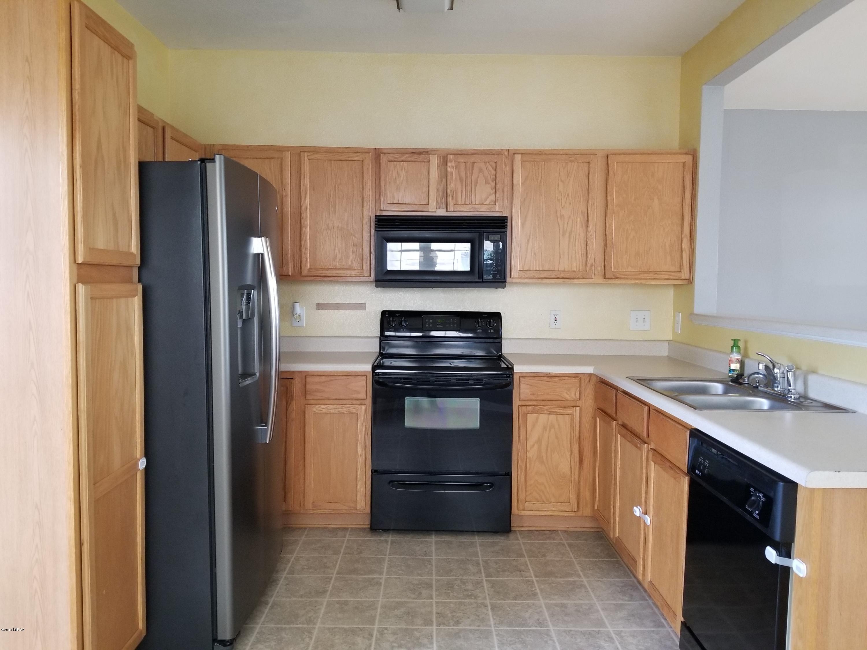 425 Bob White Road Macon, GA 31216 - Photo 8 of 20 a kitchen with a refrigerator stove and sink