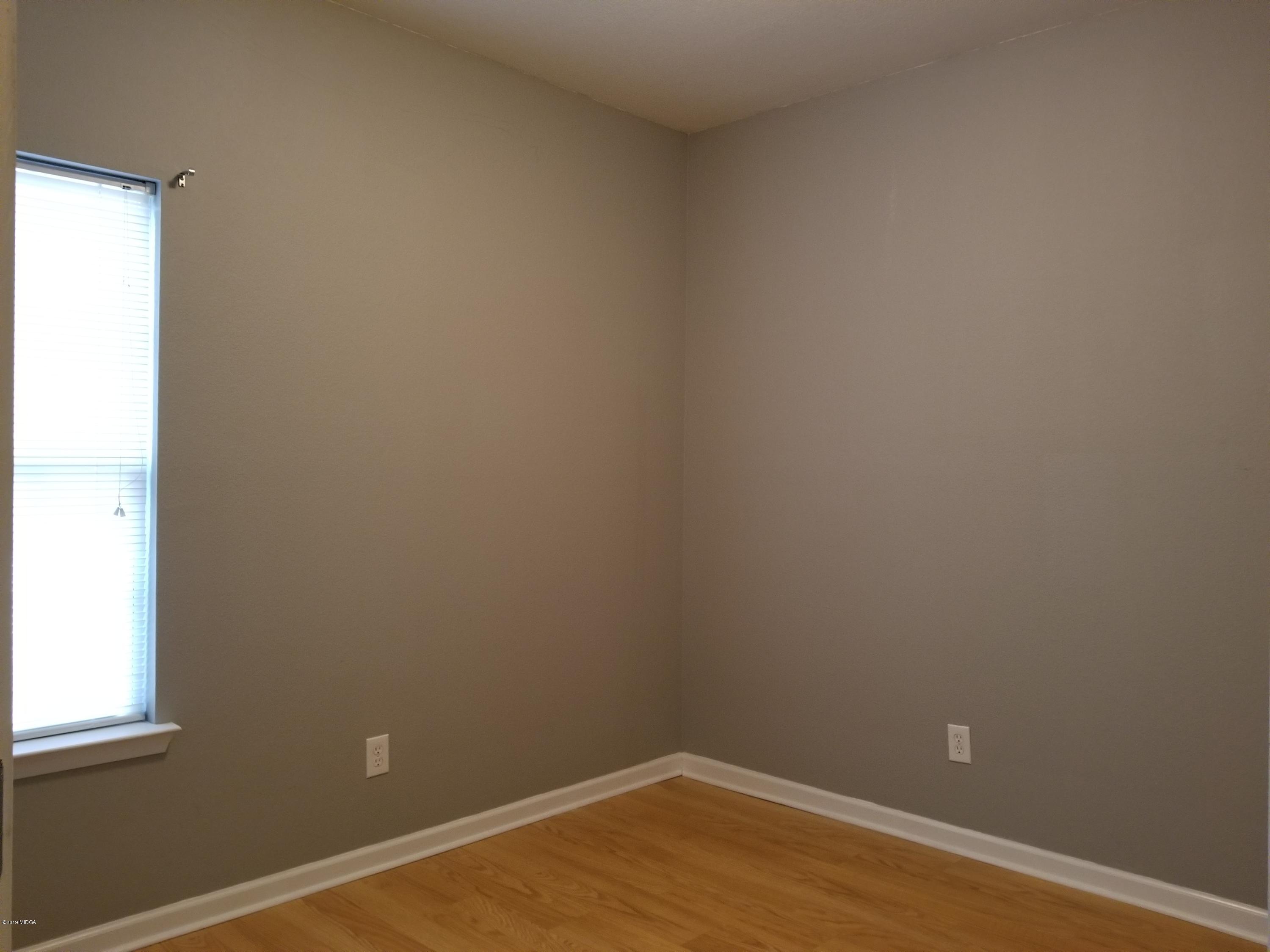 425 Bob White Road Macon, GA 31216 - Photo 10 of 20 a view of a small space with wooden floor and a window