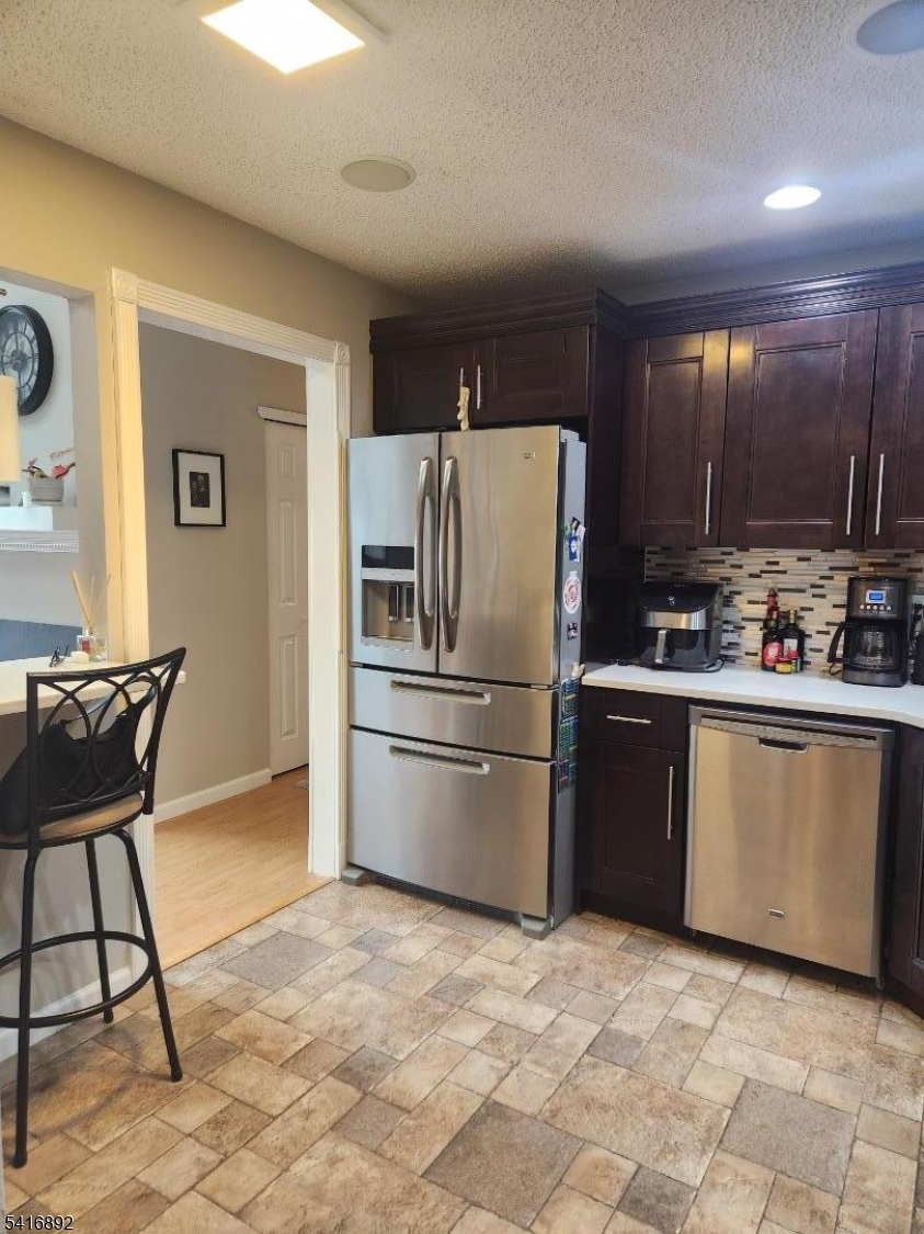 330 Penns Way Bernards, NJ 07920 - Photo 6 of 13 a kitchen with stainless steel appliances granite countertop a refrigerator stove top oven and a sink