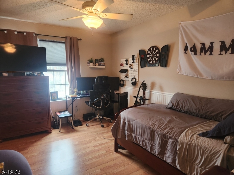 330 Penns Way Bernards, NJ 07920 - Photo 7 of 13 a bedroom with a bed and a chair