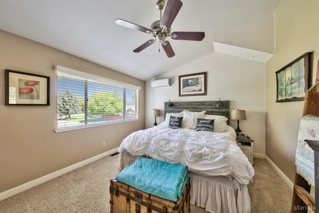 a bedroom with a bed and a table