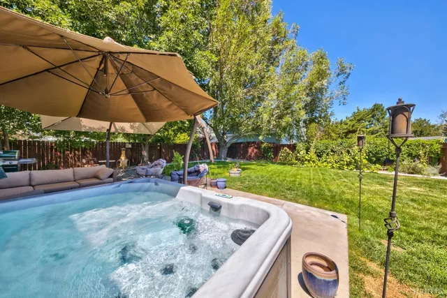 a view of a backyard with sitting area and furniture