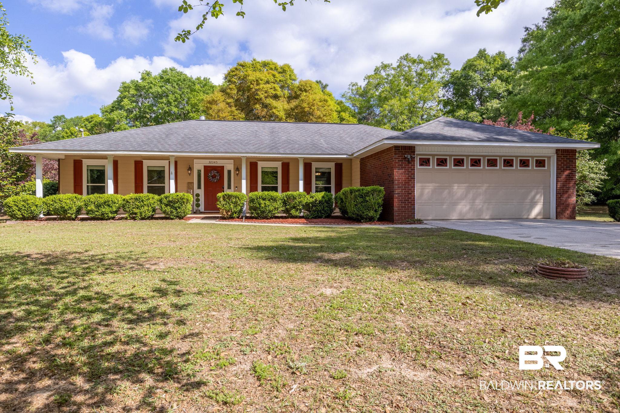 32345 River Lake Road Seminole, AL 36574 - Photo 1 of 56 Ranch-style house with a garage, driveway, a front lawn, and brick siding