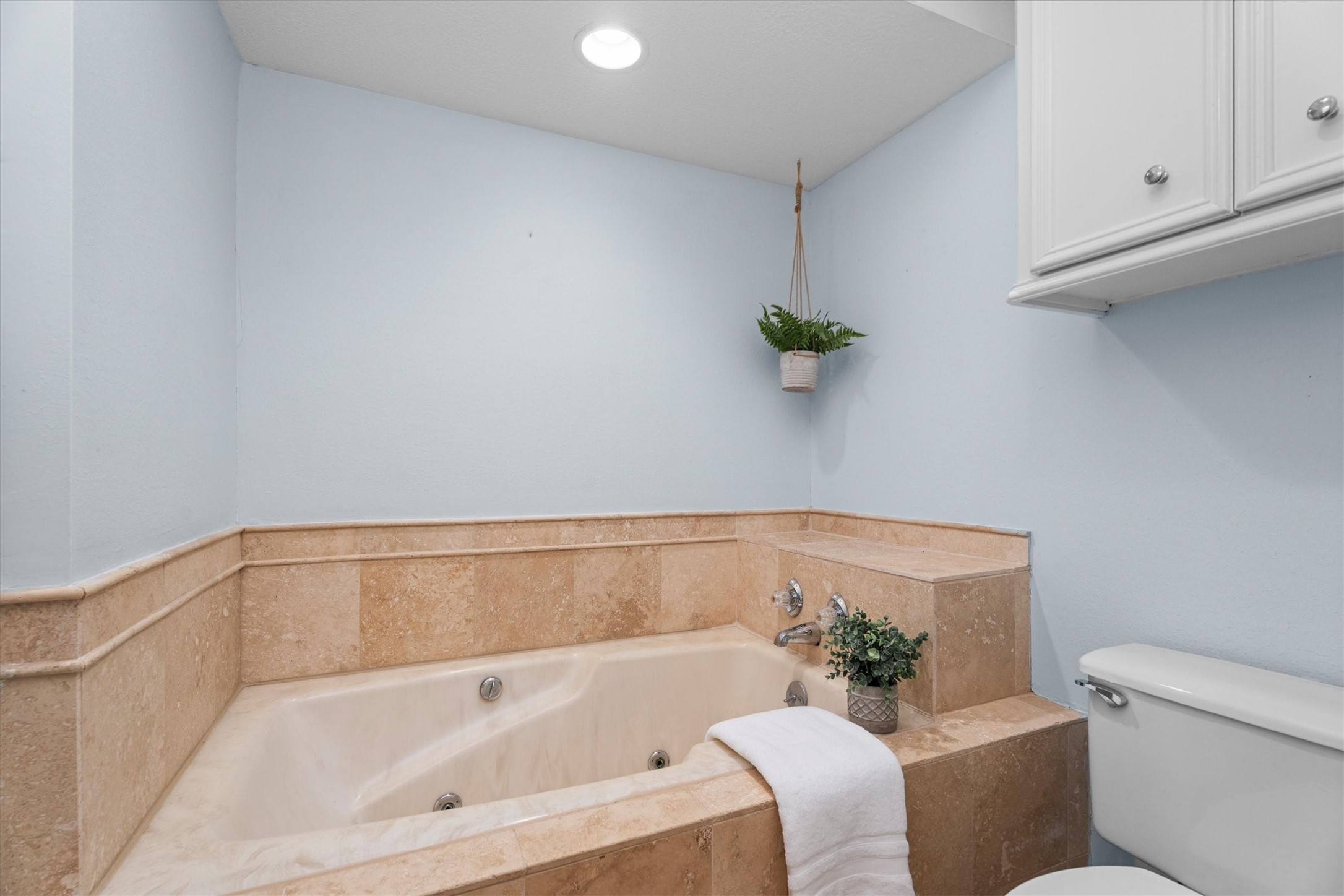 16267 Salmon Lane Spring, TX 77379 - Photo 27 of 48 Around the corner from the vanity is a separate room with a shower, large tub, and additional overhead storage to the ceiling.