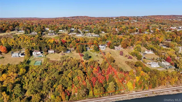 an aerial view of residential houses with city view