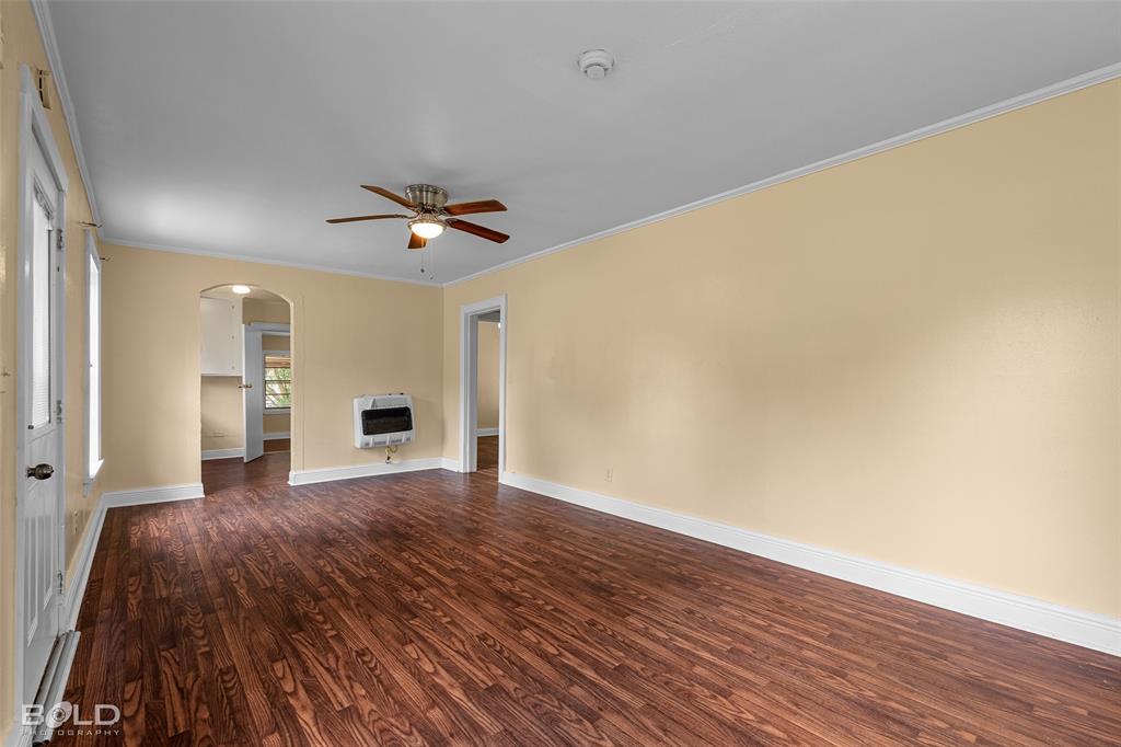 115 Pam Street Mansfield, LA 71052 - Photo 6 of 25 a view of a livingroom with wooden floor and a ceiling fan