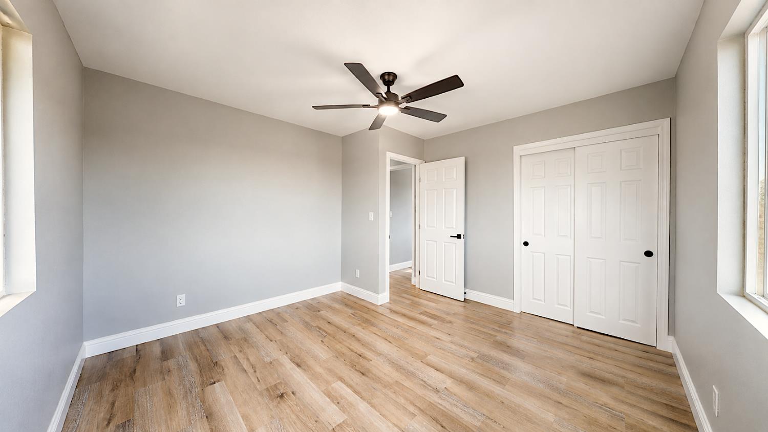 4728 Zorro Road La Grange, CA 95329 - Photo 34 of 56 Bedroom 3. Wood-finish flooring, ceiling fan, white paneled doors, and light gray walls