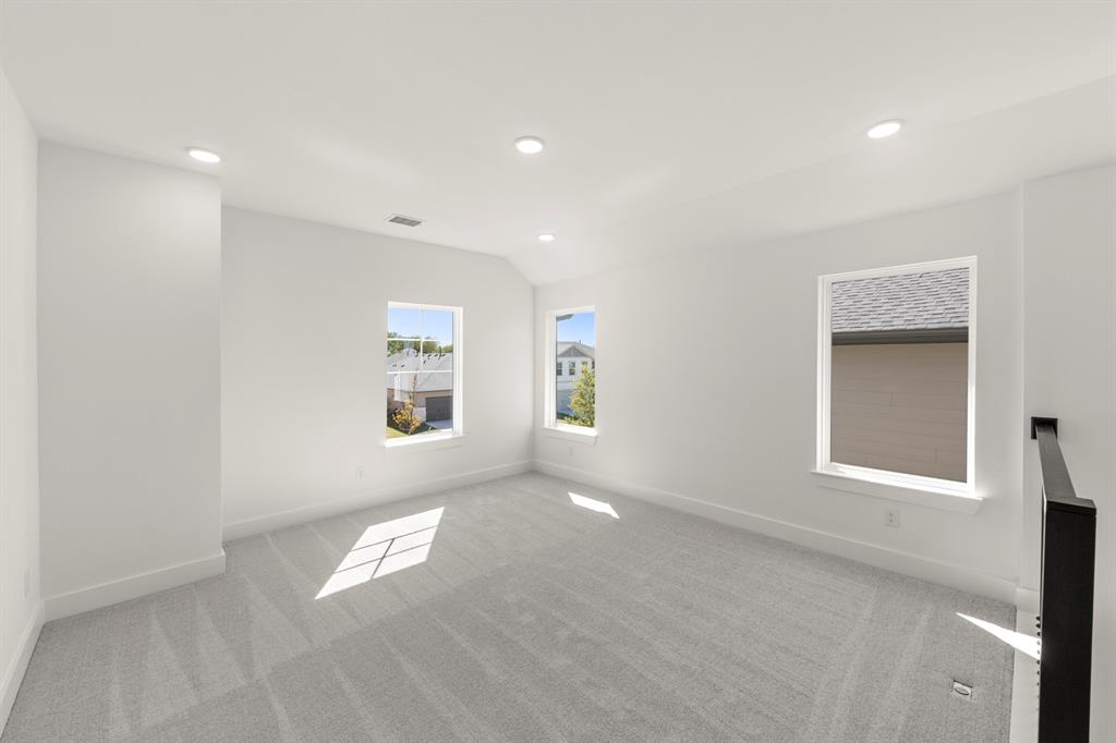 4100 Explorer Way McKinney, TX 75071 - Photo 20 of 27 an empty room with windows and closet