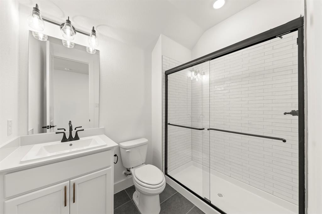 4100 Explorer Way McKinney, TX 75071 - Photo 5 of 27 a bathroom with a sink toilet and shower