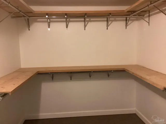 a view of a room with racks on the wall