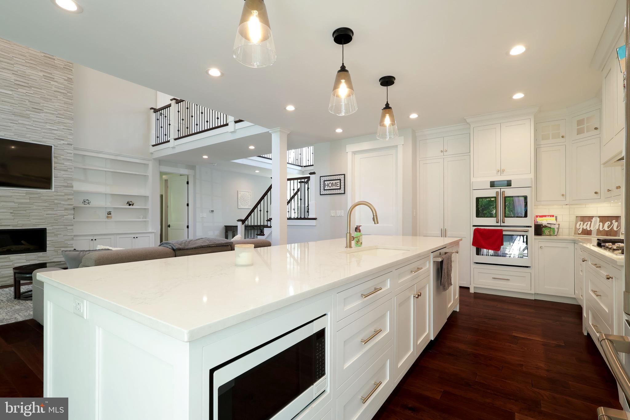 518 Two Mile Road Howard, PA 16841 - Photo 20 of 84 a large white kitchen with a stove a sink a chimney and a fireplace