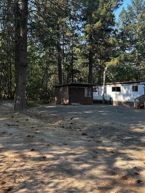 1833 Stringer Gap Road Grants Pass, OR 97527 - Photo 16 of 23 Front of home with Storage shed
