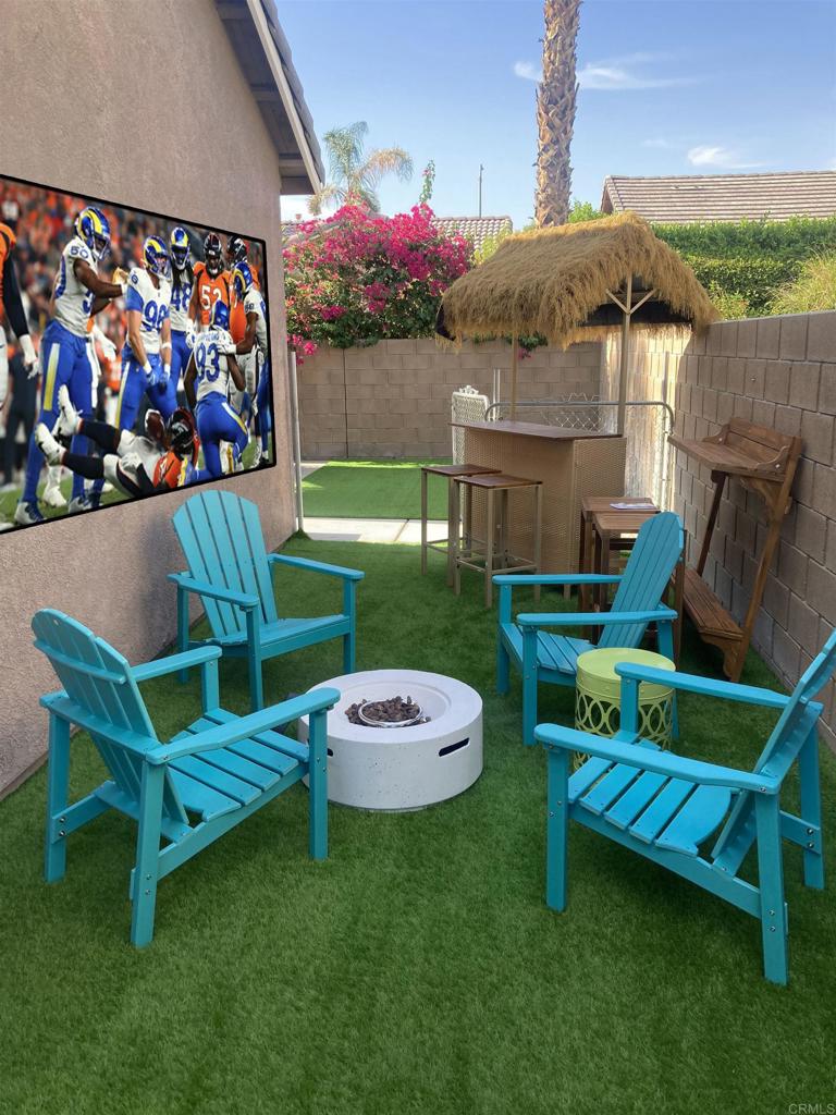 80596 Key Largo Avenue Indio, CA 92201 - Photo 32 of 59 a view of a chair and table in backyard of the house