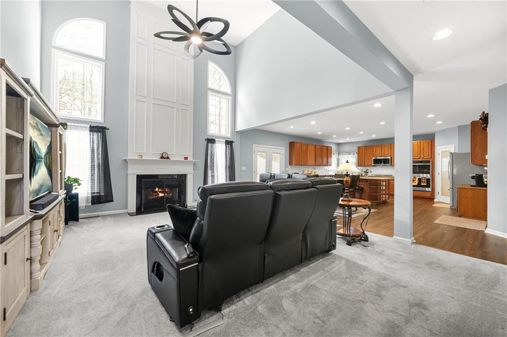 1203 Big Tree Pointe Villa Rica, GA 30180 - Photo 11 of 42 a living room with furniture a fireplace and a flat screen tv