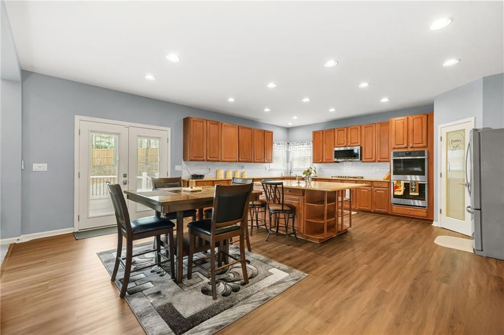 1203 Big Tree Pointe Villa Rica, GA 30180 - Photo 13 of 42 a view of a dining area with furniture window and wooden floor