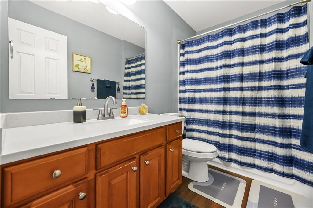 1203 Big Tree Pointe Villa Rica, GA 30180 - Photo 23 of 42 a bathroom with a sink toilet and shower
