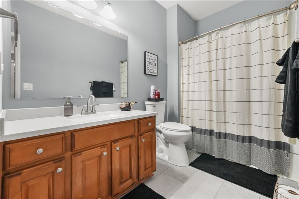 1203 Big Tree Pointe Villa Rica, GA 30180 - Photo 32 of 42 a bathroom with a sink toilet and shower