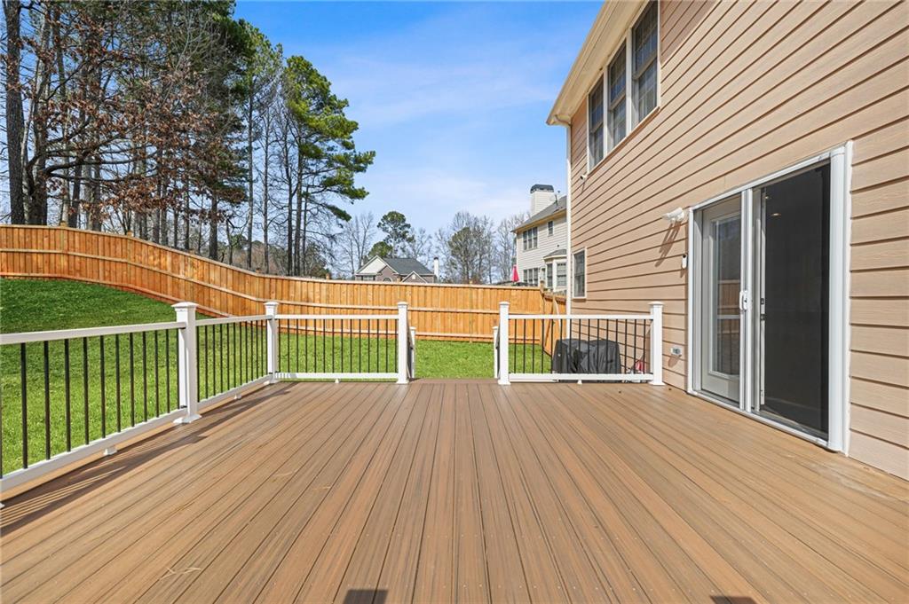 1203 Big Tree Pointe Villa Rica, GA 30180 - Photo 38 of 42 a view of a wooden deck with a yard