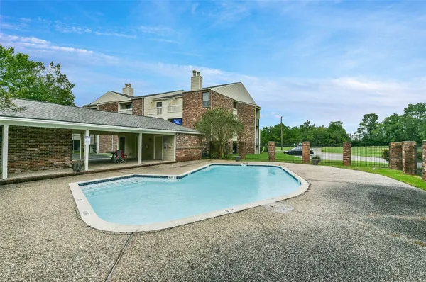 a view of a house with a swimming pool
