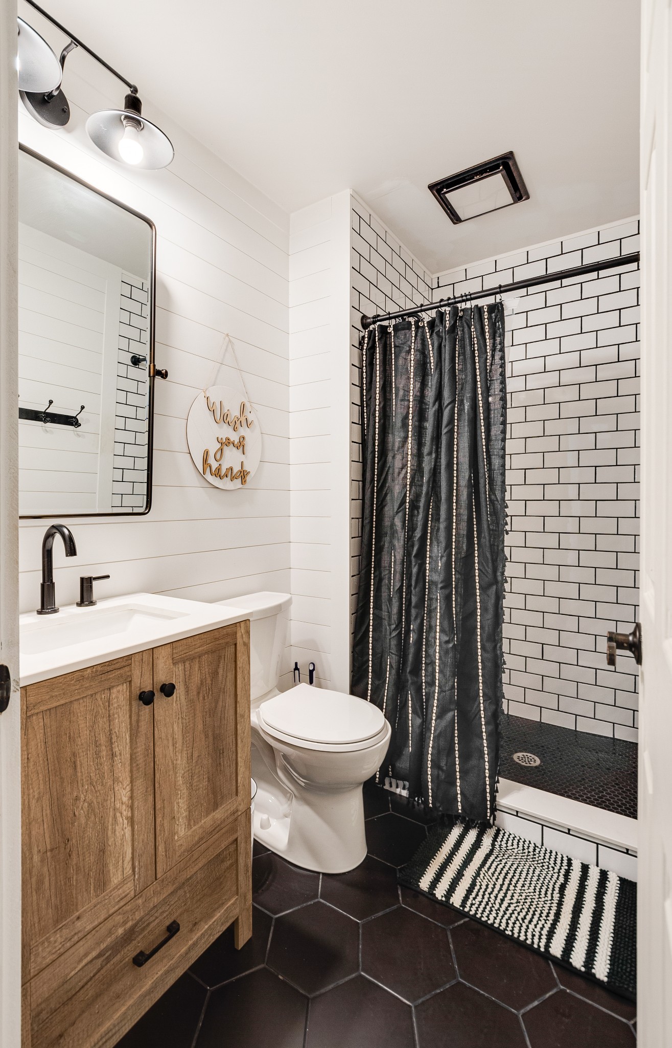 122 West Harper Road Portland, TN 37148 - Photo 33 of 74 a bathroom with a sink toilet a mirror and shower