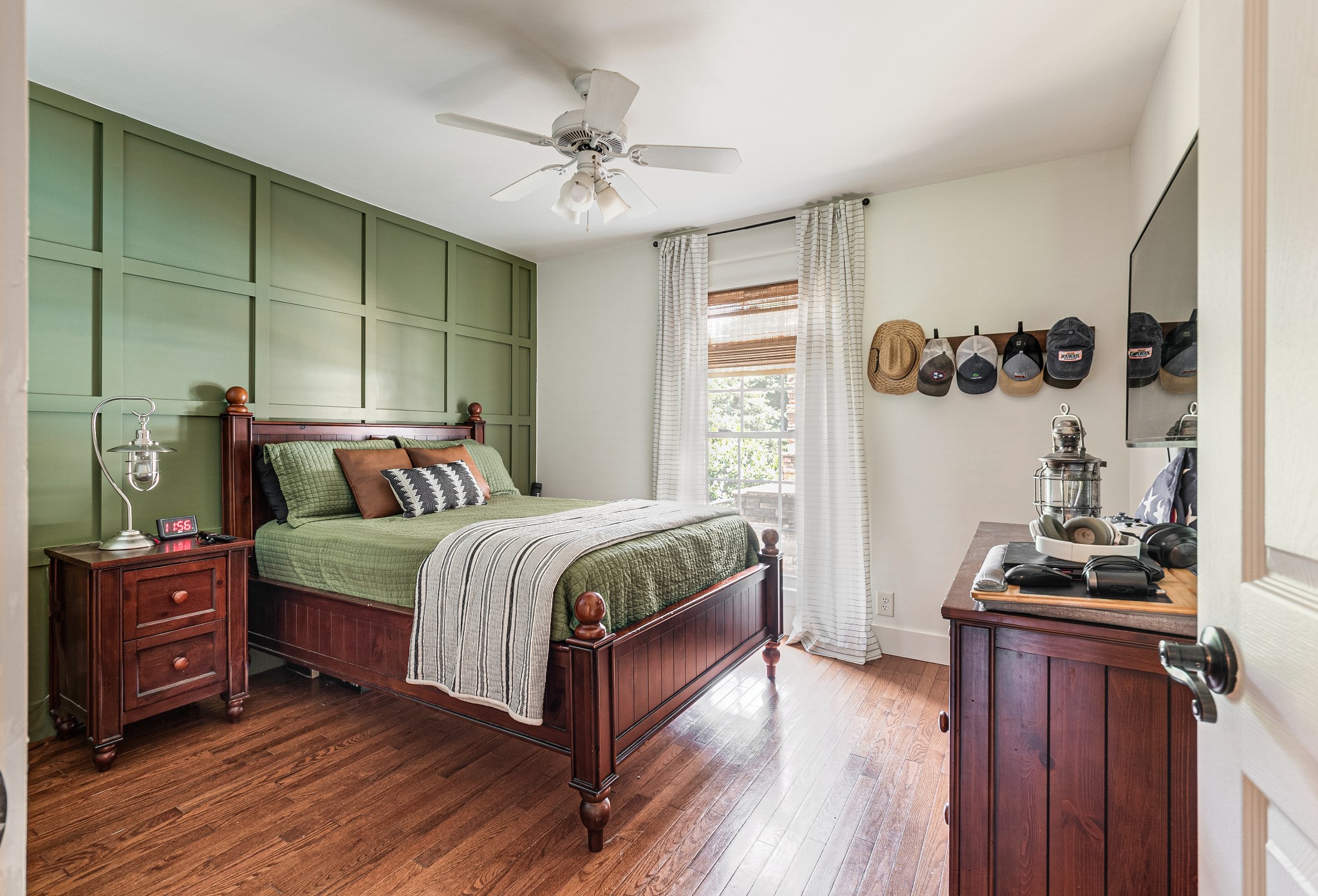 122 West Harper Road Portland, TN 37148 - Photo 34 of 74 a bedroom with a bed and wooden floor