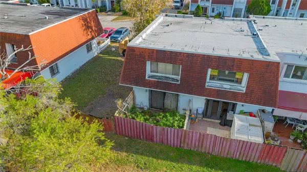 an outdoor view of the house with swimming pool