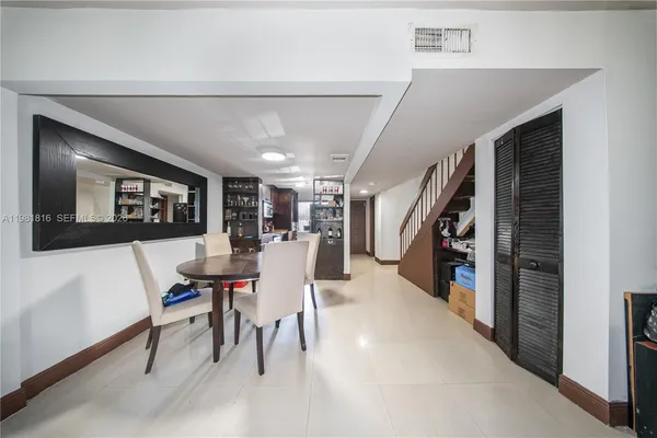 a view of a hallway with seating area
