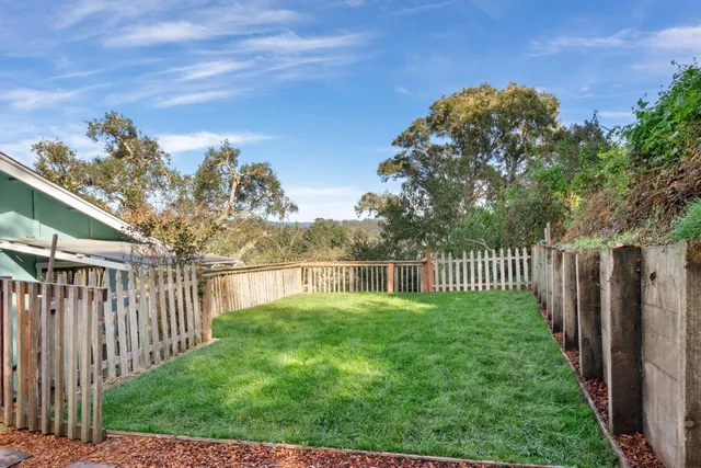a view of a deck with a big yard