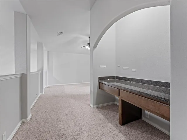 a view of room with wooden floor