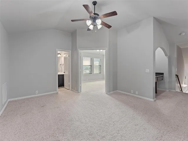 wooden floor in an empty room and a ceiling fan window