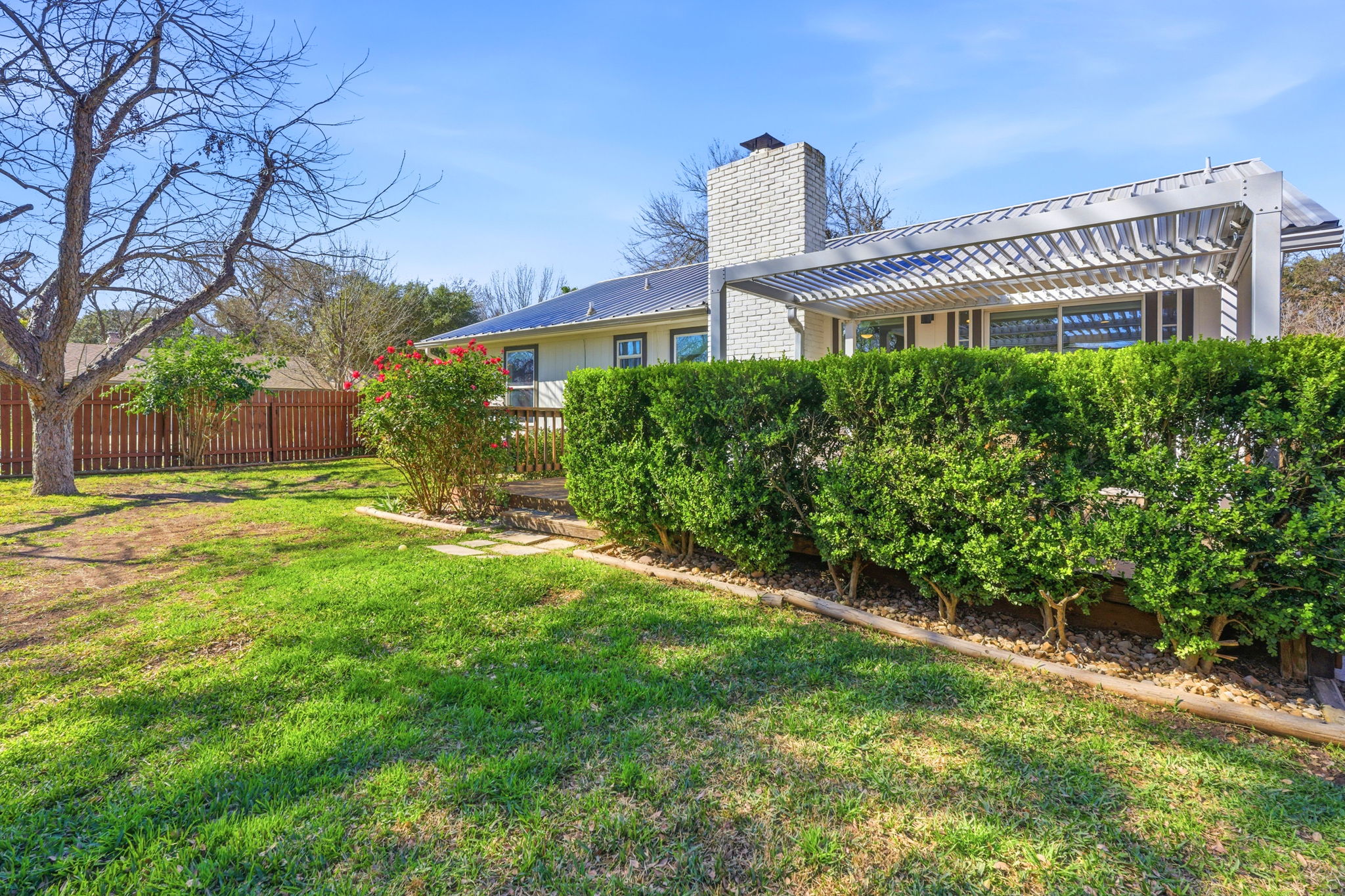 7105 Windrift Way Austin, TX 78745 - Photo 26 of 32 a front view of a house with a yard
